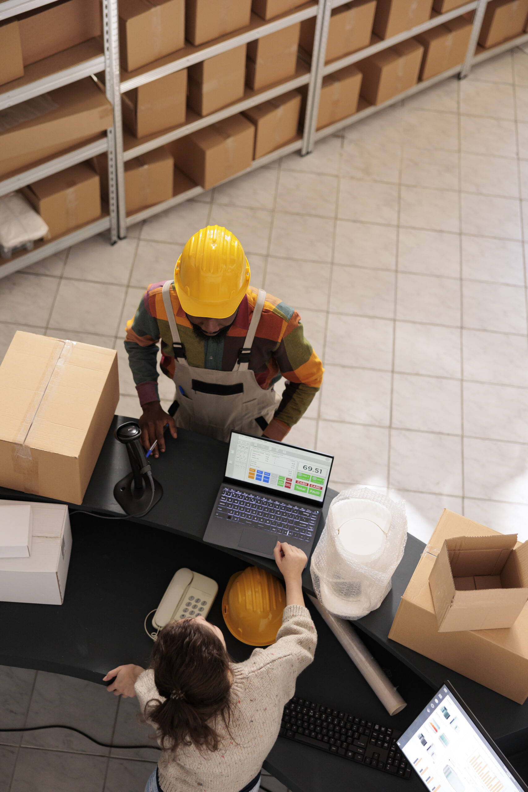 Home top view diverse team discussing customer order scaled.jpg